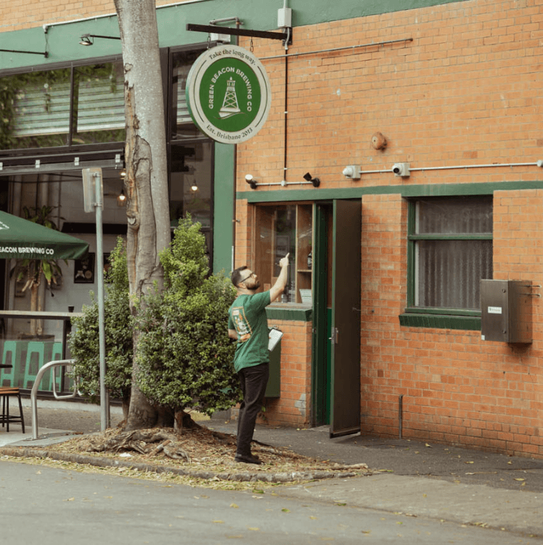 Person inspecting a commercial property – the kind of business Beacon Insurance works with